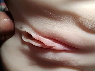 Close-up doll double penetration stretches shaved pussy wide