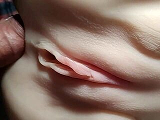 Close-up doll double penetration stretches shaved pussy wide