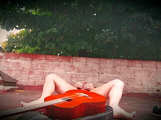 Sexy muscular bodybuilder strokes monster cock outdoors guitar style