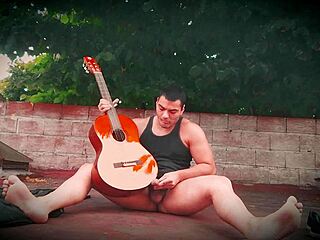 Sexy muscular bodybuilder strokes monster cock outdoors guitar style