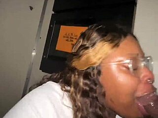 Ebony BBW throats stranger BBCs at gloryhole