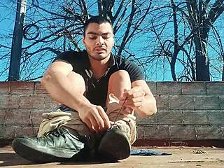 Muscular man masturbates big cock outdoors