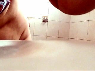 damn, that busty thick voyeur wife showers to show off her huge tits and curves...
