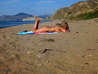 blonde cutie flashes her trimmed pussy naked on beach