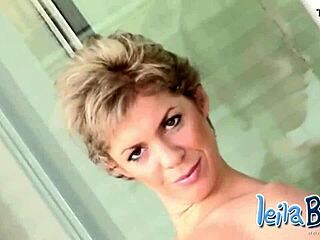 busty blonde milf teases big tits stripping panties on balcony