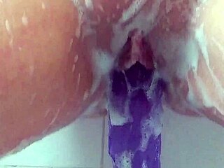 milf masturbates in bath using big purple 12-inch dildo till cum