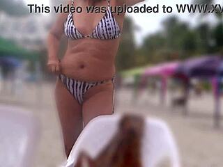 On the beach I show my hairy pussy