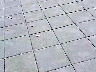 crossdressing ladyboy goes out and pees outdoors at noon