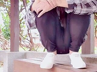 crossdressing ladyboy goes out and pees outdoors at noon