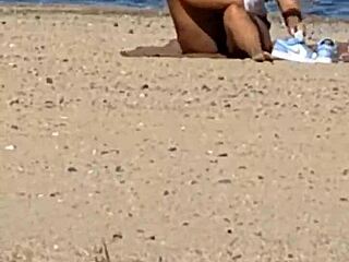 juicy asian teases on the beach in candid view