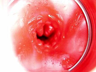 close up view of big cumshot inside redhead doll