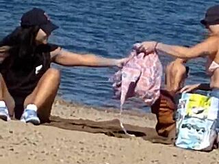 juicy asian teases on the beach in candid view