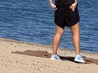 juicy asian teases on the beach in candid view