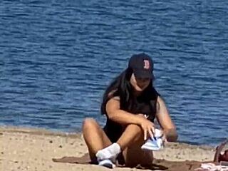 juicy asian teases on the beach in candid view