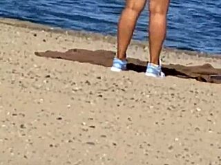 juicy asian teases on the beach in candid view