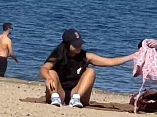 juicy asian teases on the beach in candid view