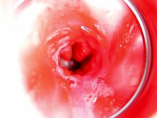 close up view of big cumshot inside redhead doll