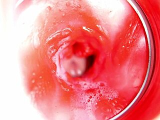 close up view of big cumshot inside redhead doll