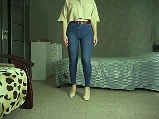 Teasing tight blue jeans with thongs