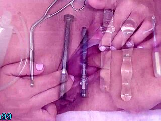 lesbian fills other uterus with piss using tube in peehole