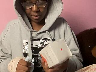 ebony webcam model unboxes a new sex toy for viewers