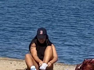 juicy asian teases on the beach in candid view