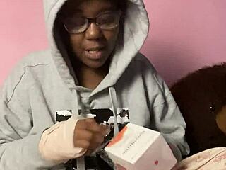 ebony webcam model unboxes a new sex toy for viewers