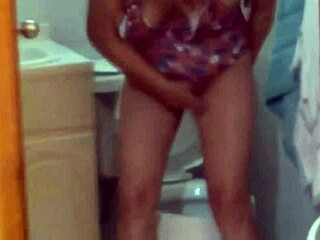 i record my stepmom urinating on the beach and washing her hairy pussy