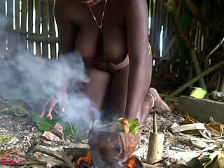 national geographic footage shows busty tribe girl cooking dinner outside